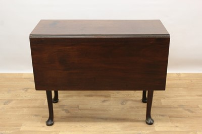 Lot 1426 - George II Cuban mahogany drop-leaf table on cabriole legs and pad feet