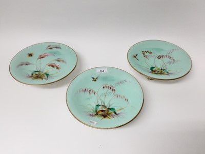Lot 164 - Late Victorian porcelain dessert service decorated with butterflies and flora on turquoise ground, comprising three comports and twelve plates (15)