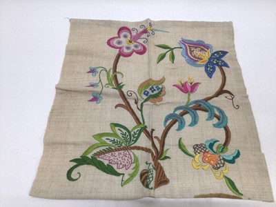 Lot 1918 - Three circa 1930s crewel work squares.  A box of worked tablecloths and mats with coloured thread embroidered flowers and garlands, crochet, filet and tatting lace edged cloths