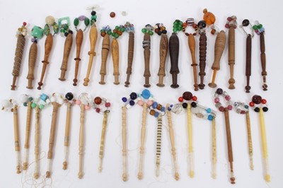 Lot 745 - Collection of lace bobbins, including turned treen examples with glass spangles and others in bone, approximately 34