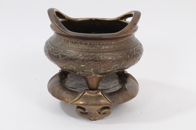 Lot 883 - Chinese bronze censer and stand with remains of gilding