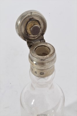 Lot 441 - Victorian silver mounted glass bottle, possibly for whisky, with hinged cover, (Birmingham 1897), maker Hukin & Heath, 13.5cm in overall height