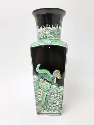 Lot 150 - Chinese famille noire porcelain vase, 19th/20th century, of tapered rectangular form, painted with dragons on each side, with fish and horses around the neck, six-character Kangxi mark to base, 36c...