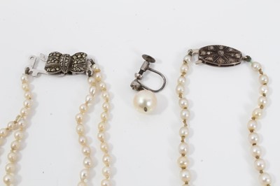 Lot 452 - Cultured pearl necklace with a string of graduated cultured pearls measuring approximately 7.2mm to 3.3mm (incorporating seven simulated pearls) on a diamond clasp, together with a two-strand cultu...