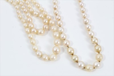 Lot 452 - Cultured pearl necklace with a string of graduated cultured pearls measuring approximately 7.2mm to 3.3mm (incorporating seven simulated pearls) on a diamond clasp, together with a two-strand cultu...
