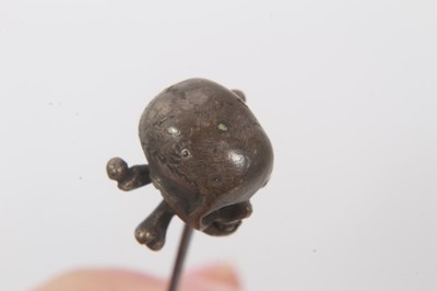 Lot 78 - Victorian momento mori stick pin with brass skull and cross bones on a steel pin