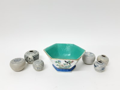 Lot 168 - Late 19th century Chinese famille rose porcelain bowl, of hexagonal form, decorated with birds, 17cm wide, and six early blue and white Chinese jars (7)