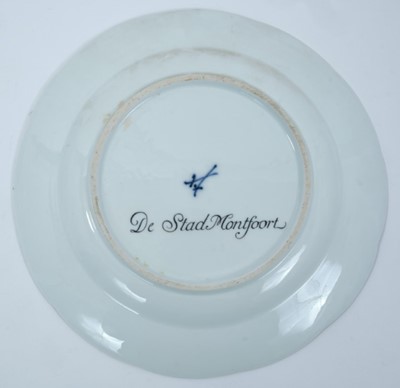 Lot 173 - A Meissen plate from the Stadhouder William V service, circa 1772-74, blue crossed swords and dot mark, the centre painted with a view of 'De Stad Montfoort', titled on the reverse in black script,...
