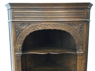 Lot 176 - Carved oak corner cabinet H180, W79, D42cm