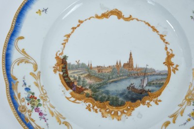Lot 174 - A Meissen plate from the Stadhouder William V service, circa 1772-74, blue crossed swords and dot mark, the centre painted with a view of 'De Stade Arnhem', titled on the reverse in black script, t...