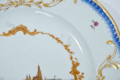 Lot 174 - A Meissen plate from the Stadhouder William V service, circa 1772-74, blue crossed swords and dot mark, the centre painted with a view of 'De Stade Arnhem', titled on the reverse in black script, t...