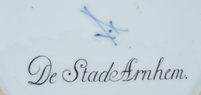 Lot 174 - A Meissen plate from the Stadhouder William V service, circa 1772-74, blue crossed swords and dot mark, the centre painted with a view of 'De Stade Arnhem', titled on the reverse in black script, t...