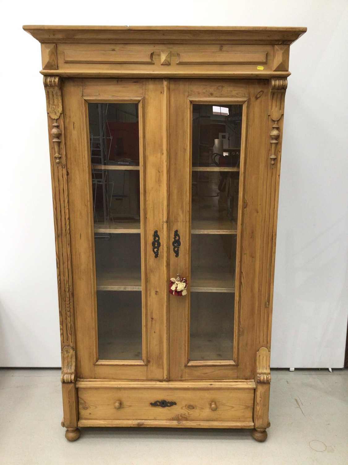 Lot 167 - Pine display unit with glass doors