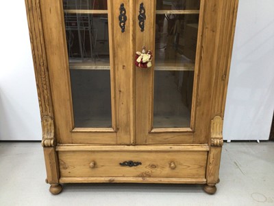 Lot 167 - Pine display unit with glass doors