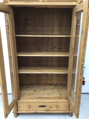 Lot 167 - Pine display unit with glass doors