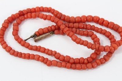 Lot 476 - Two antique coral bead necklaces, one with string of graduated coral beads measuring approximately 6.90mm to 2.75mm