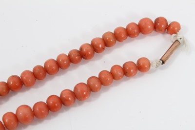 Lot 477 - Antique coral bead necklace with a string of graduated coral beads measuring approximately 8mm to 4.6mm, on a barrel clasp. Length approximately 58cm