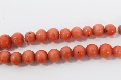 Lot 477 - Antique coral bead necklace with a string of graduated coral beads measuring approximately 8mm to 4.6mm, on a barrel clasp. Length approximately 58cm