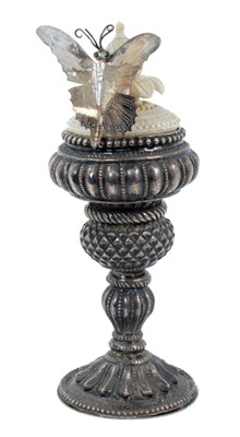 Lot 1811 - Robert Barley sculptural composition - Butterfly goblet, with white metal goblet and Eastern ivory finial, inverting to reveal a glass eye, total height 16cm