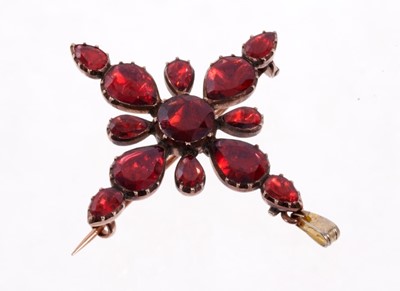 Lot 470 - Georgian garnet cross pendant/brooch with round and pear shaped flat cut garnets in foiled closed backed gold collet setting. 38mm
