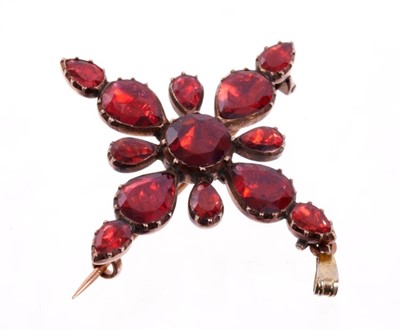 Lot 470 - Georgian garnet cross pendant/brooch with round and pear shaped flat cut garnets in foiled closed backed gold collet setting. 38mm