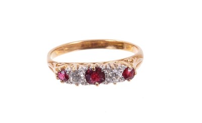Lot 484 - Late Victorian diamond and garnet five stone ring with two old cut diamonds and three round mixed cut garnets in carved gold claw setting on gold shank. Finger size M½.