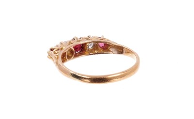 Lot 484 - Late Victorian diamond and garnet five stone ring with two old cut diamonds and three round mixed cut garnets in carved gold claw setting on gold shank. Finger size M½.