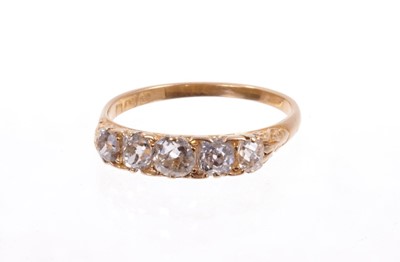 Lot 487 - Edwardian diamond five stone ring with five old cut cushion shape diamonds in carved gold claw setting on plain gold shank . Estimated total diamond weight approximately 1ct. Finger size approximat...