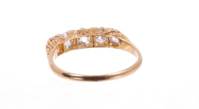 Lot 487 - Edwardian diamond five stone ring with five old cut cushion shape diamonds in carved gold claw setting on plain gold shank . Estimated total diamond weight approximately 1ct. Finger size approximat...