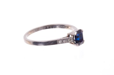 Lot 490 - Art Deco sapphire and diamond platinum ring with an octagonal step cut blue sapphire measuring approximately 6.15mm x 5.15mm x 3.05mm, with six single cut diamonds to the shoulders on platinum shan...