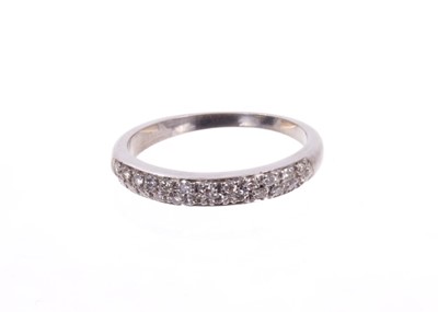 Lot 492 - Diamond eternity ring with a half hoop of pavé set brilliant cut diamonds in white gold setting. Finger size approximately O½.
