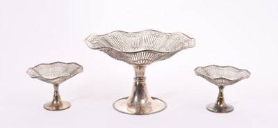 Lot 349 - Good quality George V silver comport of conventional form with fluted, pierced decoration and reeded border on flared pedestal foot, together with two matching tazzas (Birmingham 1911 / 1912), make...