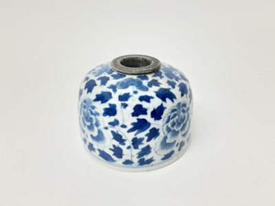 Lot 268 - 19th century Chinese blue and white porcelain inkwell, painted with flowers, seal mark to base, with later removable insert, 8.75cm diameter
