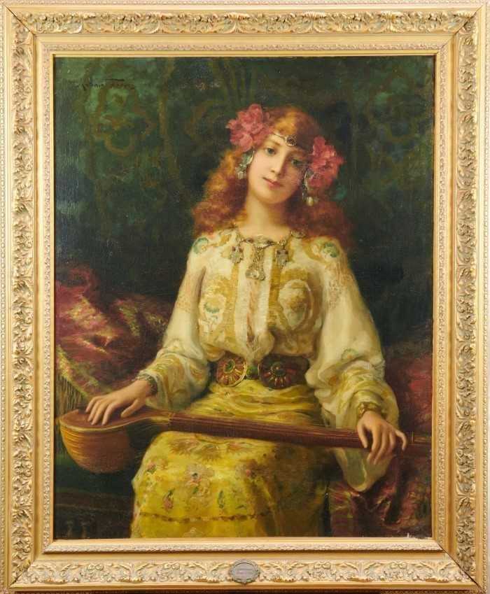 Lot 1141 - Antonio Torres Fuster (1874-1945) Orientalist portrait girl with instrument