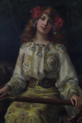 Lot 1141 - Antonio Torres Fuster (1874-1945) Orientalist portrait girl with instrument