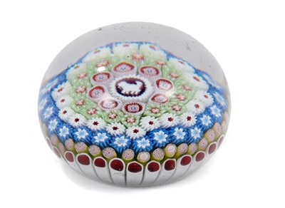 Lot 196 - Fine Saint Louis dated concentric millefiori paperweight, signed and dated SL 1848 to one cane, the centre with a silhouette of a dog facing left, 8cm diameter