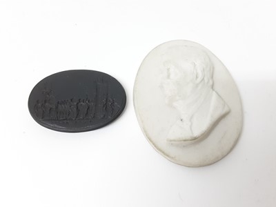 Lot 200 - Wedgwood basalt seal decorated with a classical scene, 3.5cm, and a Worcester Kerr & Co portrait medallion of Wellington by W.S. Kirk RHA, 5.25cm, both pieces marked