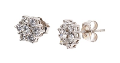 Lot 494 - Pair of diamond cluster earrings, each flower head cluster comprising seven brilliant cut diamonds in 18ct white gold setting. Estimated total diamond weight approximately 1.4cts. Diameter approxim...