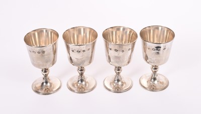 Lot 356 - Set of four Elizabeth II silver goblets of inverted bell form, with knopped stem, raised on domed circular feet, (London 1971), maker Garrard & Co Ltd, all at 24oz, each 12cm in overall height.
