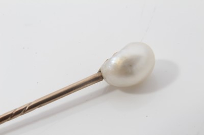 Lot 495 - Antique natural pearl stick pin with an oval natural pearl (saltwater) measuring approximately 5.8mm x 6mm x 8.5mm. Accompanied by a Pearl Report by The Gem & Pearl Laboratory dated 2014.