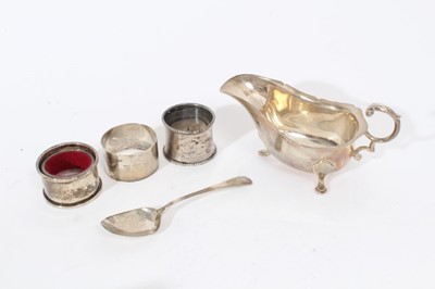 Lot 357 - Elizabeth II silver sauce boat of conventional form (Birmingham 1971), together with three silver napkin rings and a silver teaspoon (various dates and makers), all at approximately 8oz, sauce boat...
