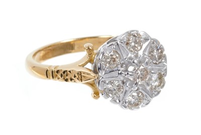 Lot 497 - Diamond cluster ring with a star shape design of seven brilliant cut diamonds in white gold setting on 18ct yellow gold setting. Estimated total diamond weight approximately 0.50cts. Finger size ap...