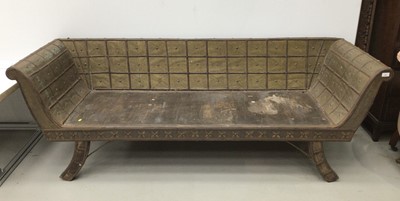 Lot 150 - Unusal wooden bench with brass and iron strap...