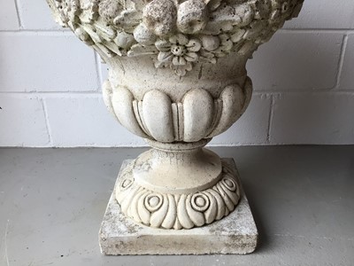 Lot 151 - Large concrete urn with floral decoration and twin handles on square base H76, W68, D49cm