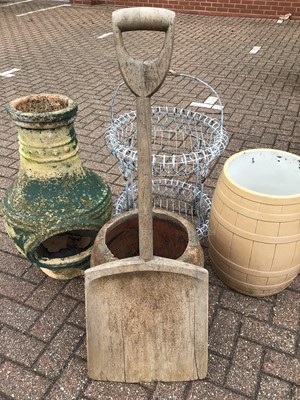 Lot 153 - Metal two tier plant stand, wooden shovel together with three other garden ornaments