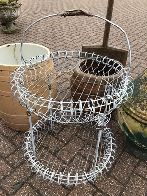 Lot 153 - Metal two tier plant stand, wooden shovel together with three other garden ornaments