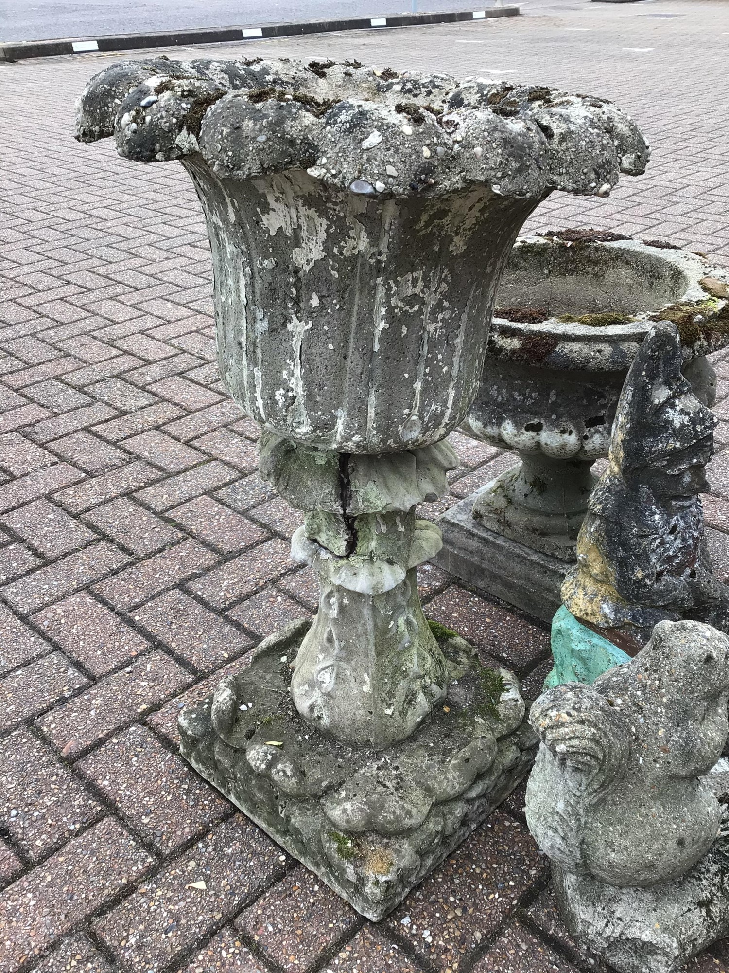 Lot 155 - Selection of four concrete garden ornaments