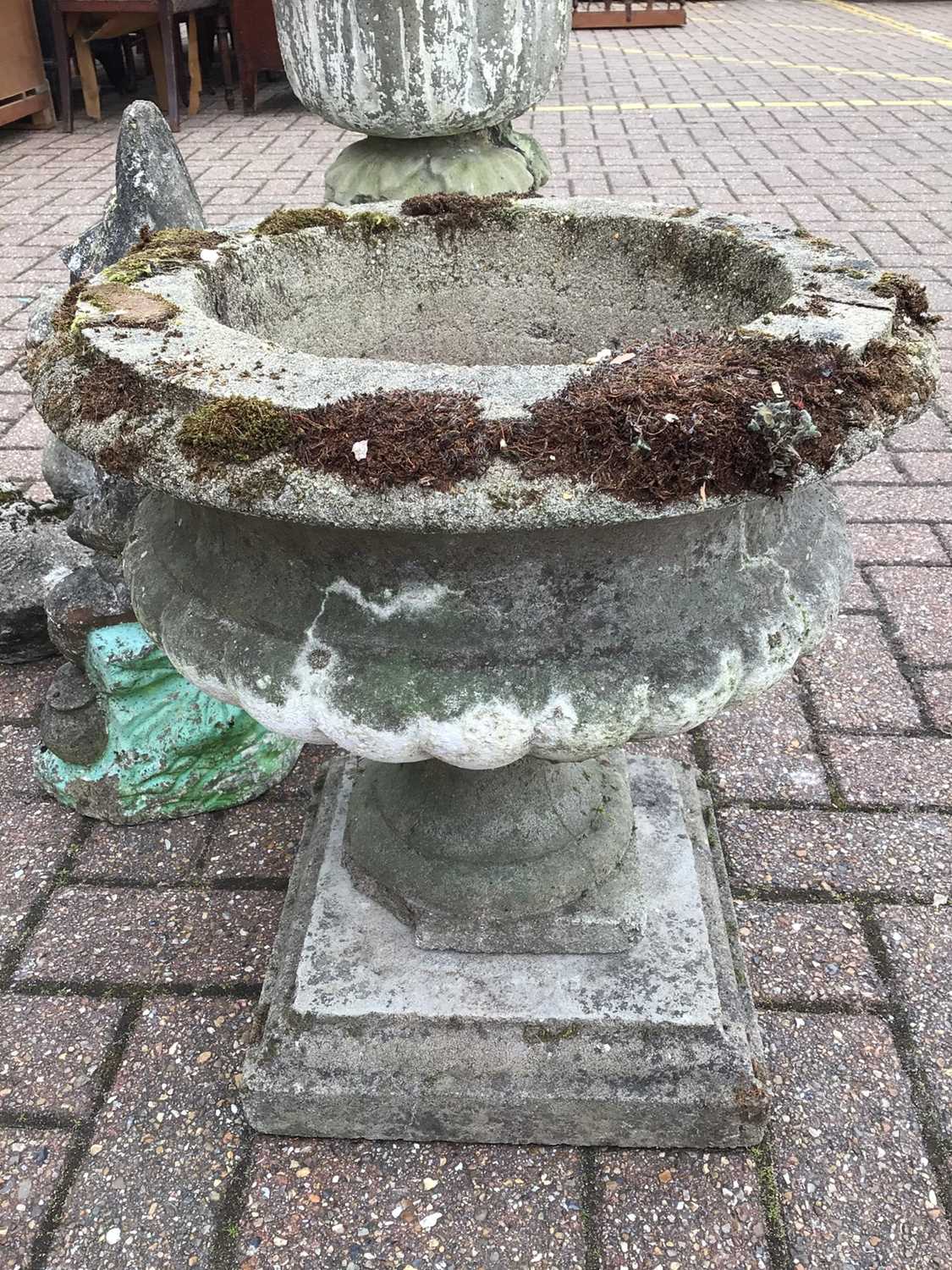 Lot 155 Selection of four concrete garden ornaments