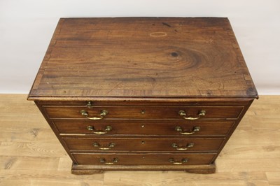 Lot 1445 - George II mahogany dressing chest of small size, with crossbanded top over brushing slide and four graduated drawers, each with brass swan neck handles on ogee bracket feet, 82cm wide x 48cm deep x...