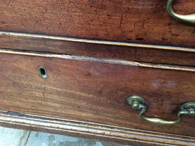 Lot 1445 - George II mahogany dressing chest of small size, with crossbanded top over brushing slide and four graduated drawers, each with brass swan neck handles on ogee bracket feet, 82cm wide x 48cm deep x...